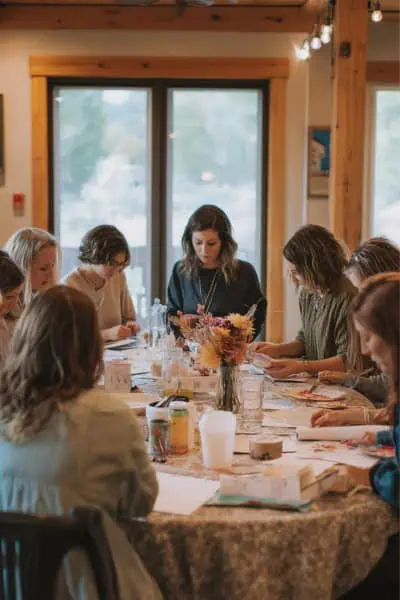 Group of women crafting a table.